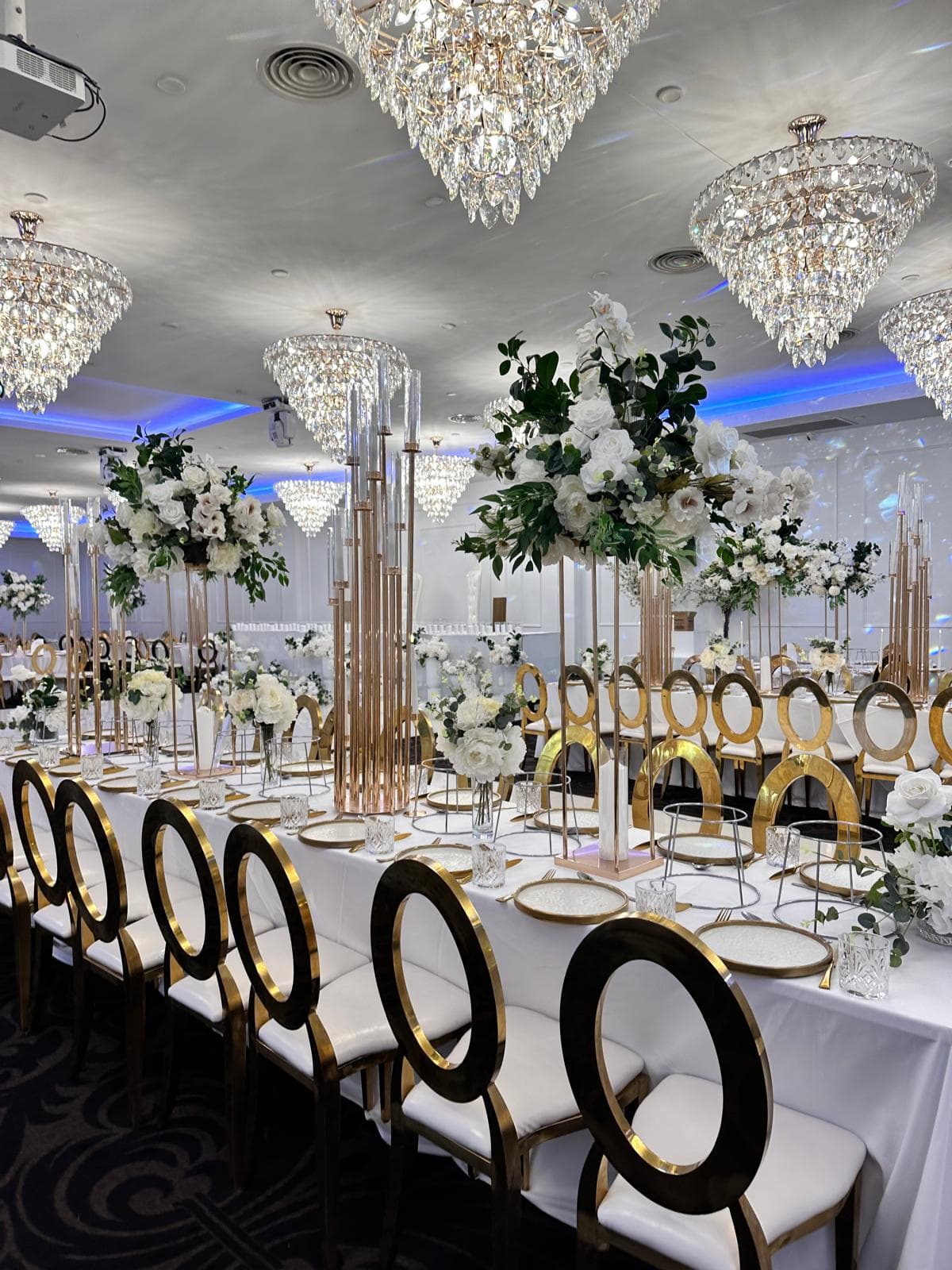 Gold stands — chandelier ballroom